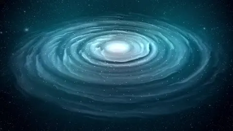 A spiral galaxy turning in deep space.