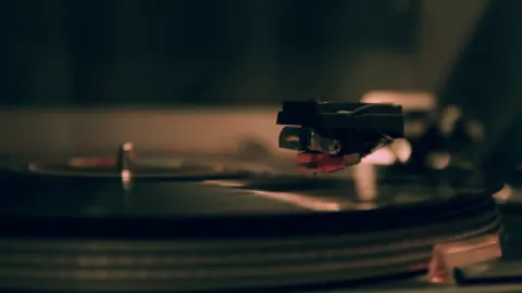 Disco lights turning in time with an unheard beat.