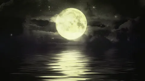 The moon reflected on still water.