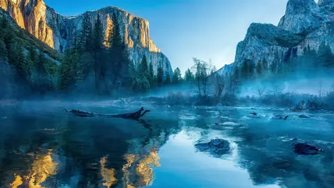 A mountain lake holding the peaks in its surface.