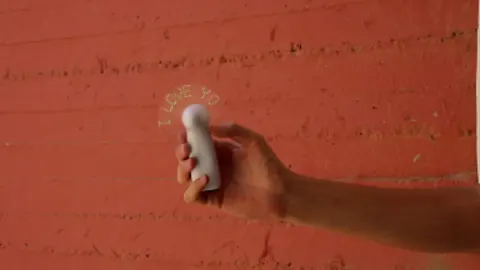 An animated fan spelling out a message of love.