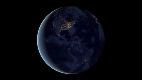 The globe turning steadily against open space.